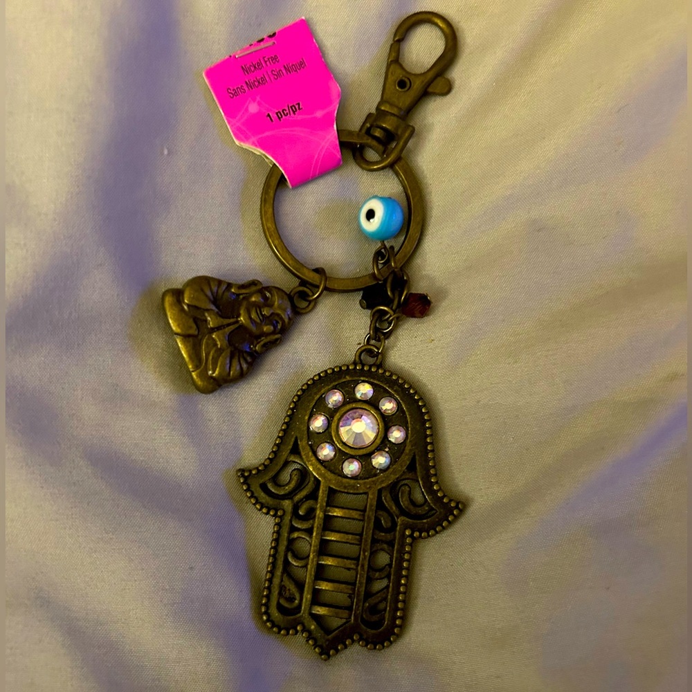 Brand new with tags Buddha sign of peace, yoga, third eye evil eye keychain